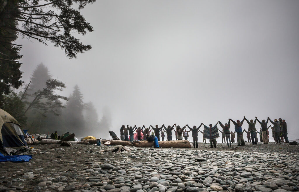 Rainbow Gatherings - a neo-pagan extension of the 1960's free love movement - involve the intentional assembly of shamans, spiritists, eco-hippies and other counter-culture individuals forming a temporary community to celebrate the elements of creation. This particular event, held at an undisclosed beach on Vancouver Island, saw some 200 members of the 'Rainbow Family' gather to uphold the concept of unity, love and human potential for many days on end.