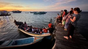 Water taxi to connect with Philippine National Coastguard patrol boat.