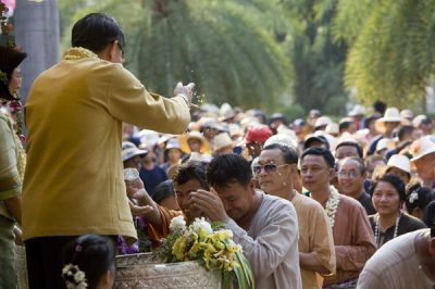 Govenor of Chiang Mai blesses community patrons during Songkran celebration.