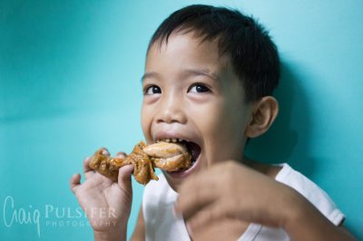 Tumana, Philippines - Children enjoy a nutritious meal thanks to Pastor Rading and Lillian Bataller's community feeding programs.