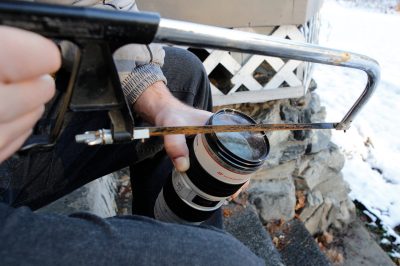 Salmon Arm, BC - Steps to remove a stuck lens filter: #1. Use hacksaw to cut rim of the filter down to the glass on 4 'sides'.