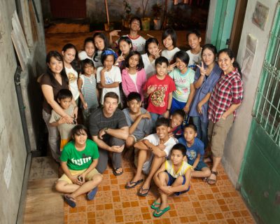 Manila, Philippines - At Papa John's orphanage, children ages 5-20 are being cared for by Gemma Bucuyag (mid-left), who left her dental practice to care for children at risk.